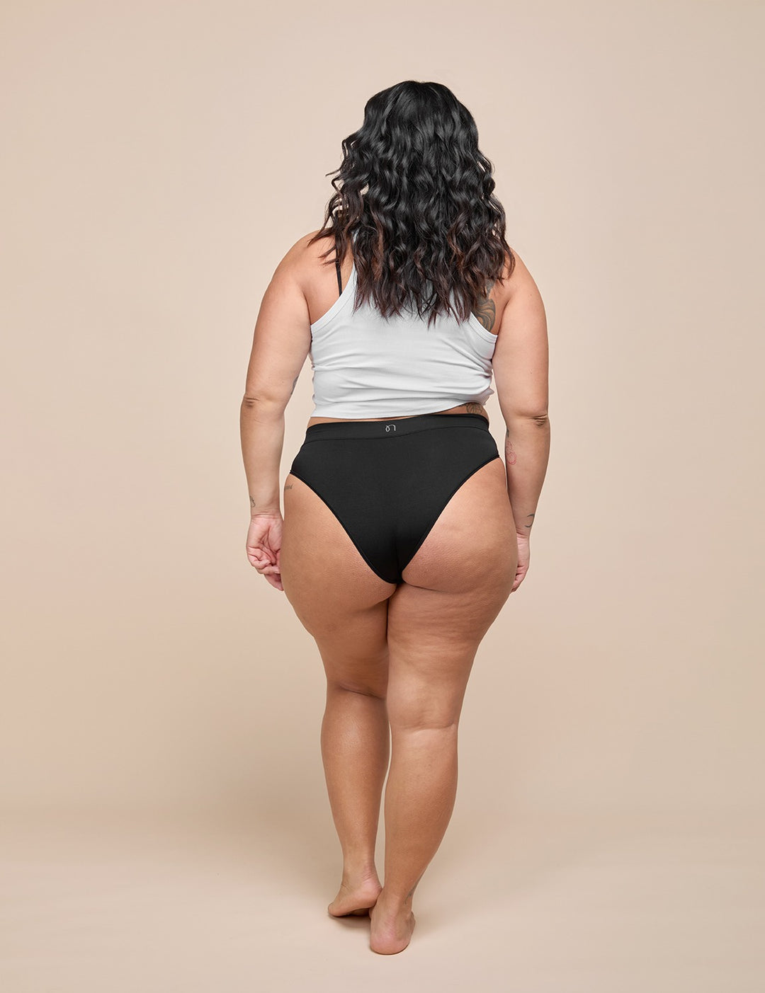 Light bikini with light gray backless-style top and black high-waist bottom