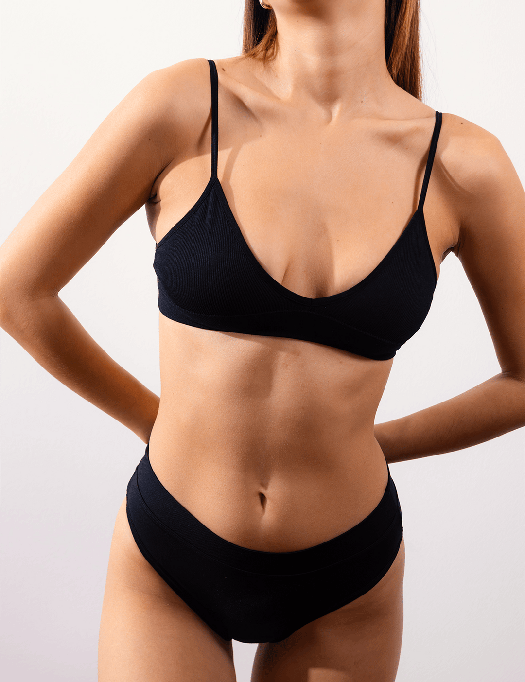 Black triangle bralette with deep V front and thin spaghetti straps