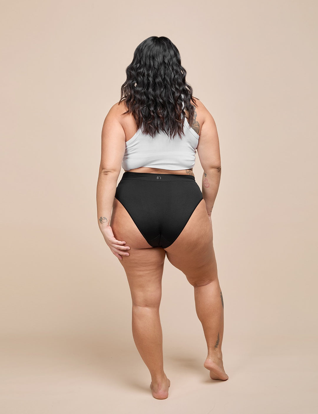 Model wearing the black heavy absorbency bikini, back view