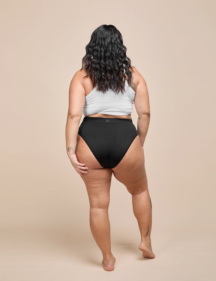 Model wearing the black heavy absorbency bikini, back view