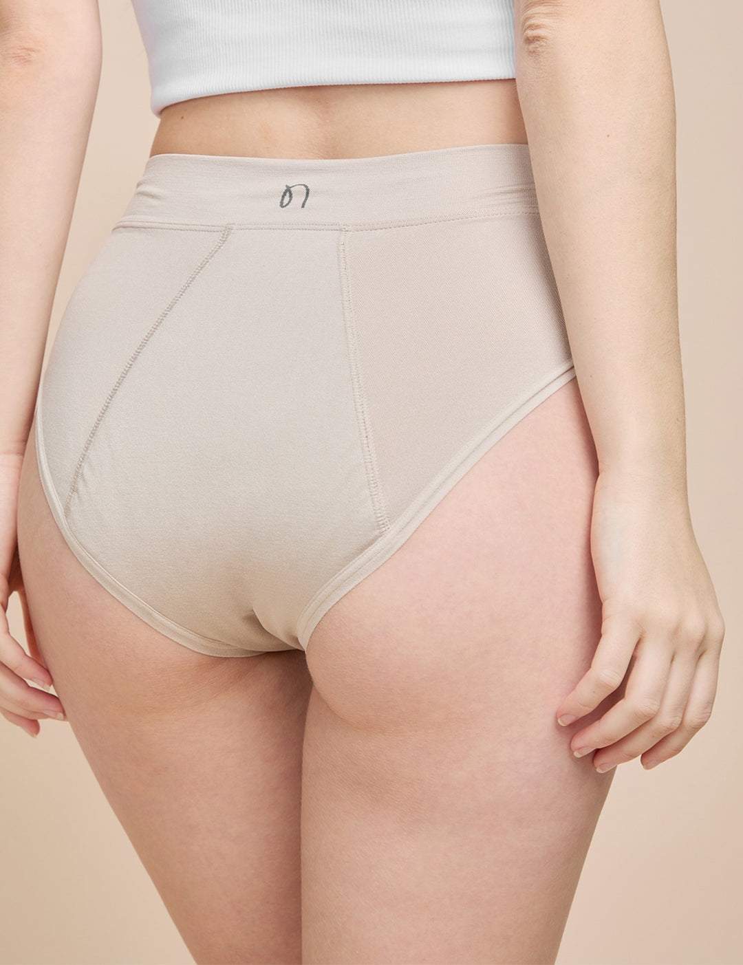 Beige heavy absorbency brief, high-rise with smooth front panel