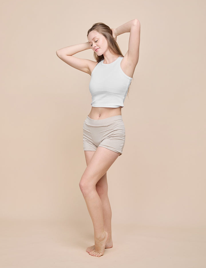 Beige heavy absorbency short on model, side view